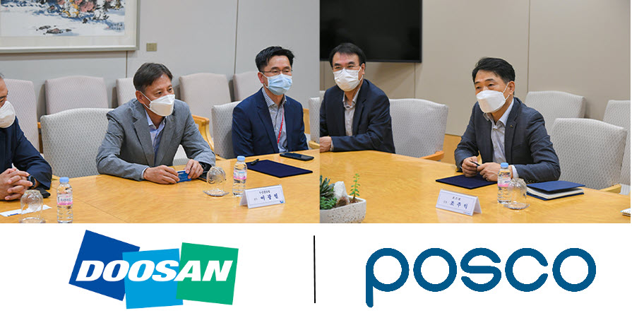 The MoU signing ceremony, with Doosan and POSCO officials present.