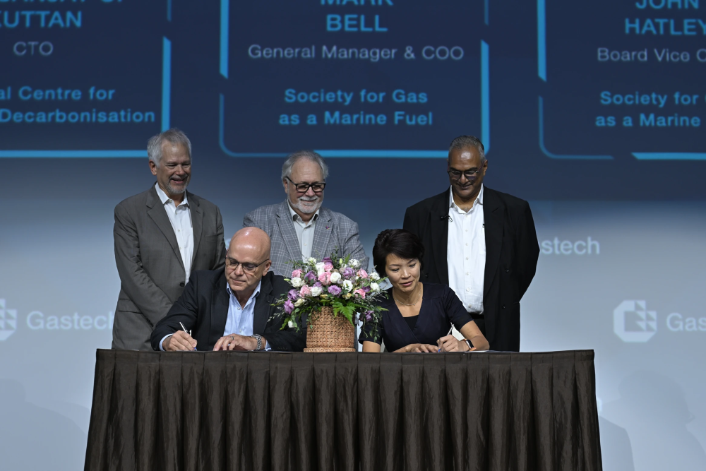Executives from GCMD and SGMF sign the new partnership agreement in Singapore this month. Source: GCMD.